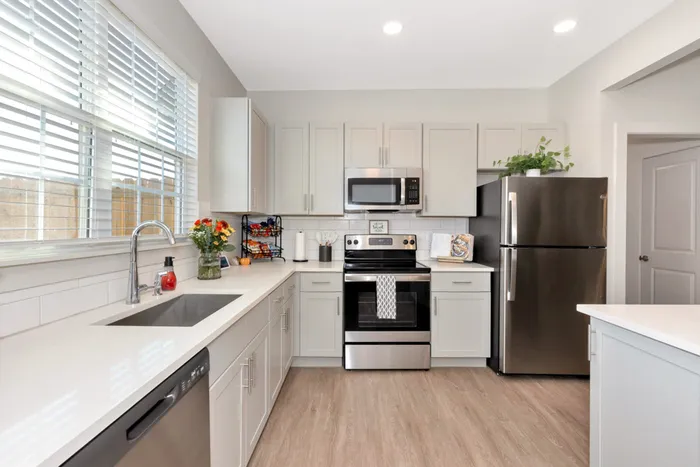 Furnished kitchen with stainless steel appliances