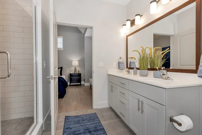 Furnished bathroom with walk-in shower