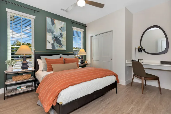 Furnished bedroom with bed and built-in desk