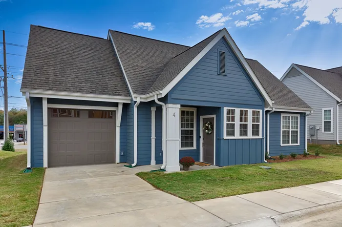 Exterior of home with garage on a sunny day
