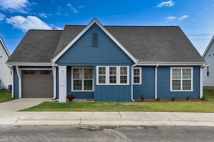 Exterior of home with garage on a sunny day