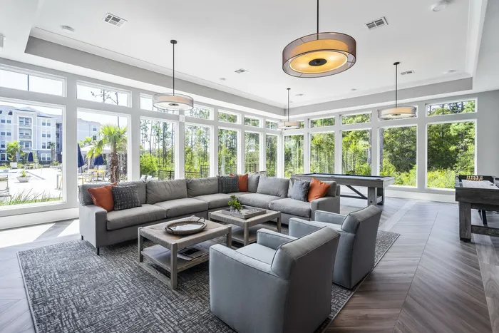 furnished resident clubroom with sofa and table