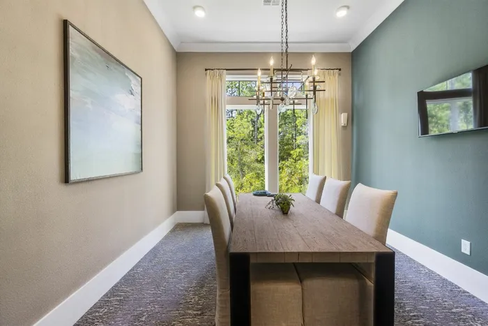 furnished business center with table and chairs