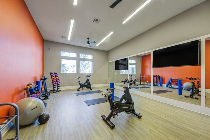 furnished yoga room with equipment