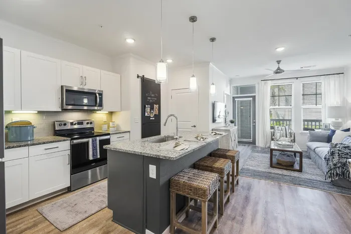 furnished kitchen with island in apartment home