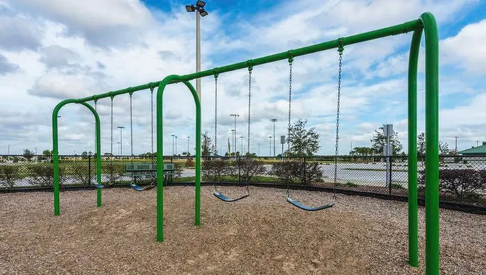 playground swings in daytime