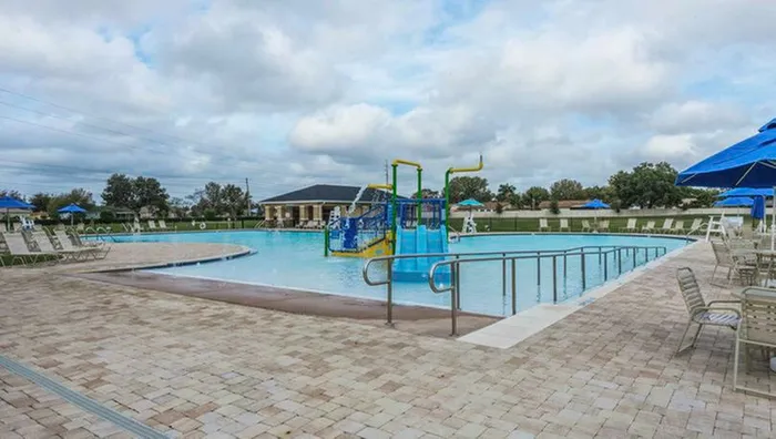 pool with playground in it in daytime