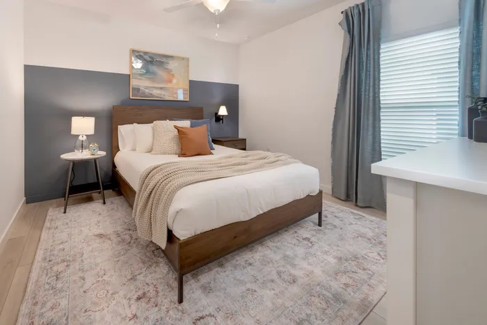 Furnished bedroom with bed and side tables
