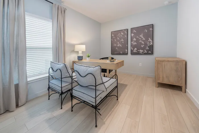 Furnished office nook with desk and seitting chairs