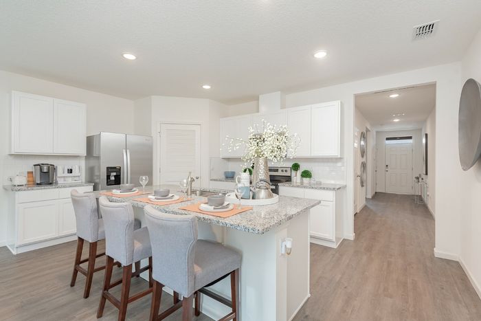 furnished kitchen with island in home