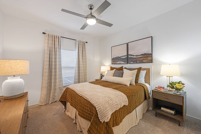furnished bedroom with carpet