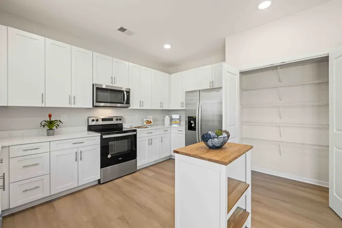 kitchen with white cabinets and stainless steel appliances