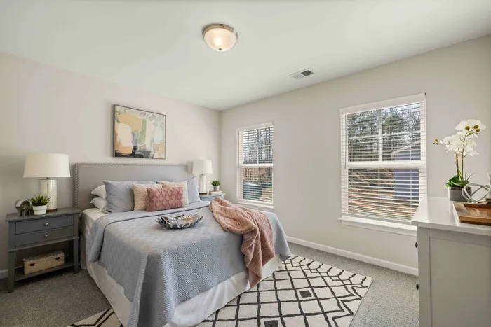 furnished bedroom with carpet