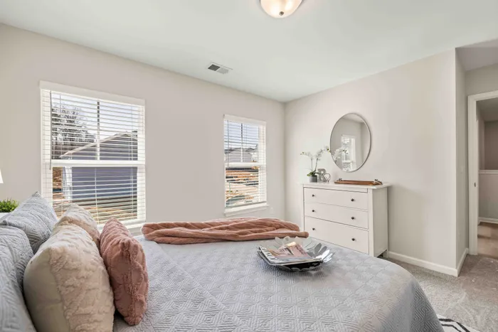furnished bedroom with carpet