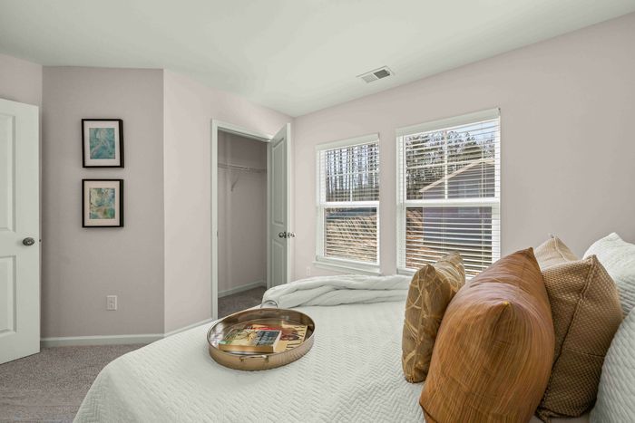 furnished bedroom with natural lighting