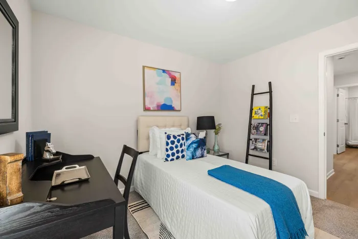 furnished guest bedroom with natural lighting