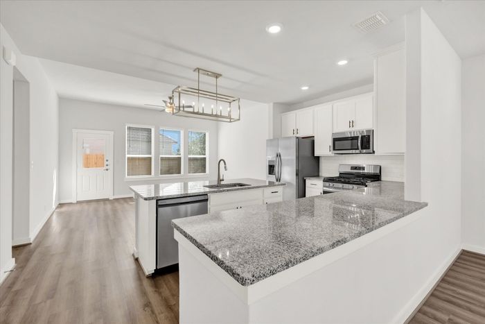 unfurnished kitchen and living area