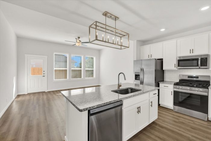 unfurnished kitchen and living area