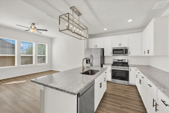 unfurnished kitchen and living area