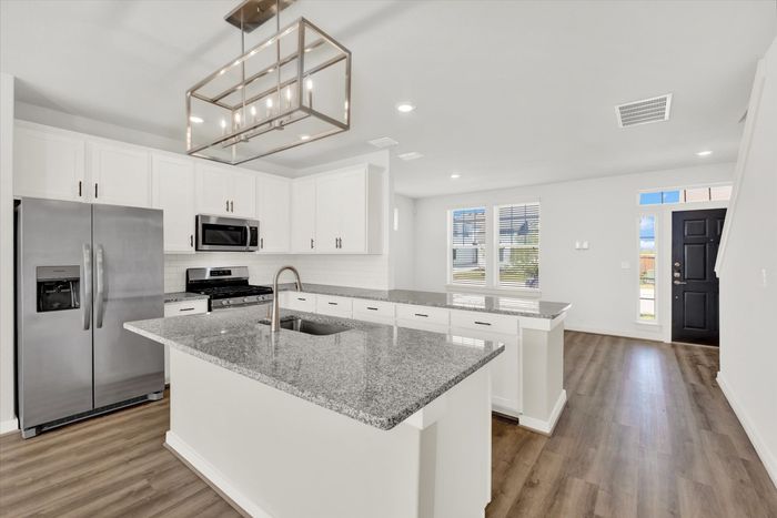 unfurnished kitchen and living area