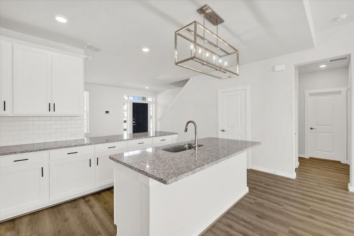unfurnished kitchen and living area