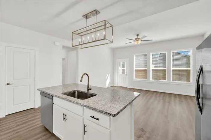 unfurnished kitchen and living area