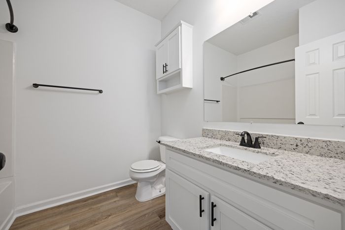 Bathroom with sink and large mirror