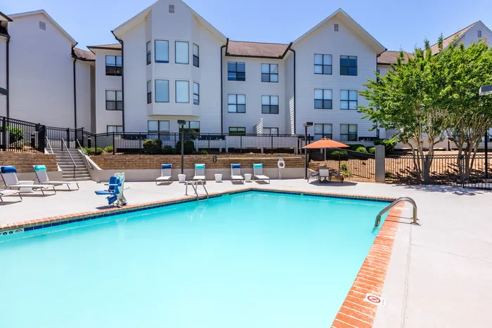 exterior pool and apartment building on sunny day
