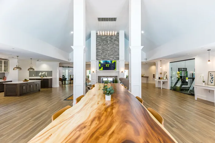 long dining table in furnished clubroom at apartment community