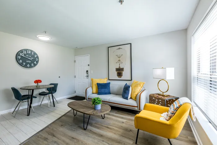 furnished kitchen, living and dining area of apartment home