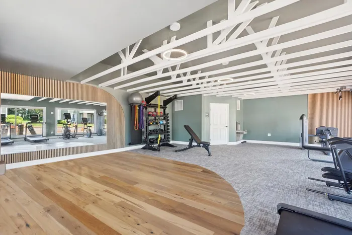 Fitness center with yoga area and free weights