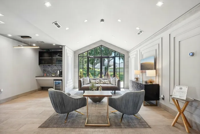 Furnished clubroom with floor to ceiling windows