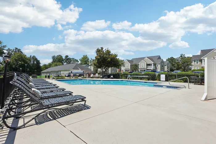 Community pool with lounge chairs