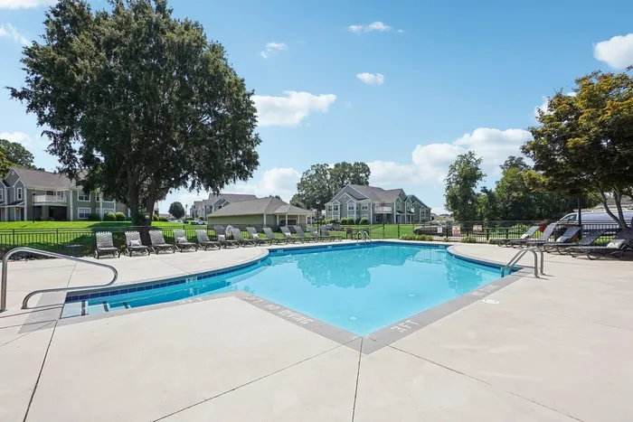 Community pool with lounge chairs
