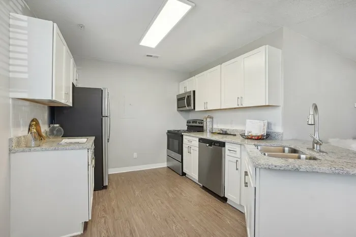 Kitchen with white cabinets and stainless steel appliances