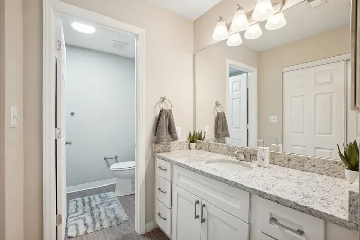 Bathroom with white cabinets