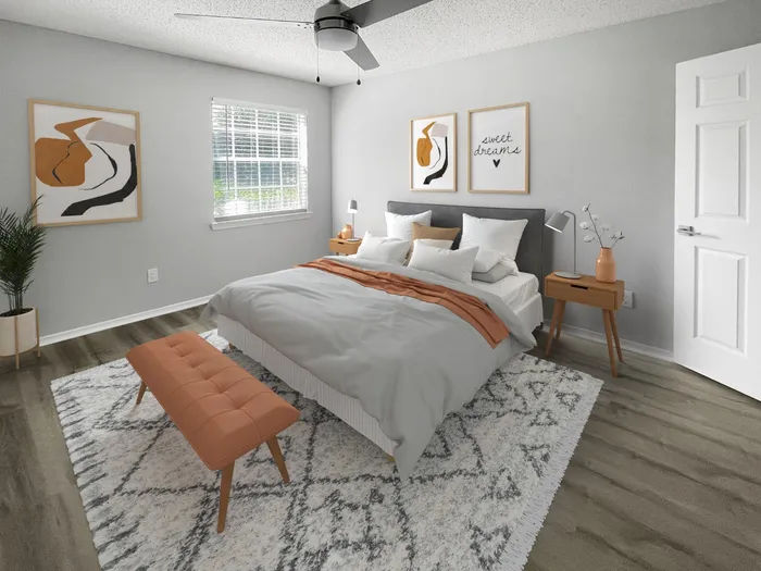 West Melbourne, FL Apartments - Caribbean Isle - Bedroom with Natural Sunlight, a Ceiling Fan, and Double Nightstands
