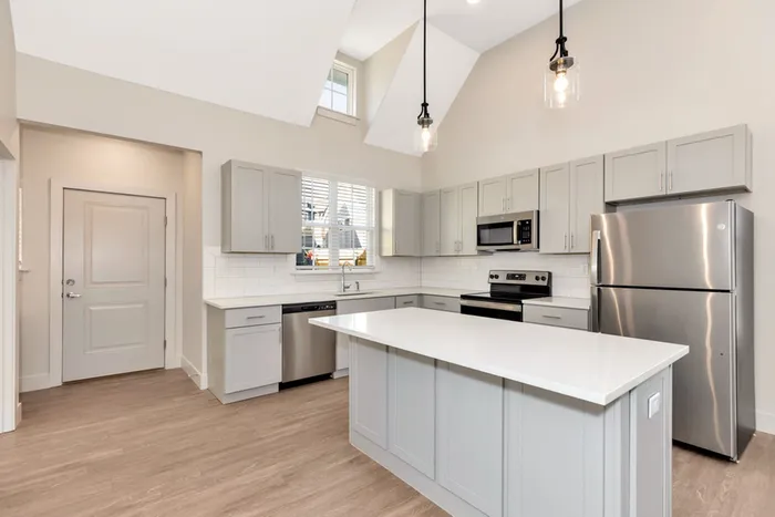 kitchen with tall ceiling and island