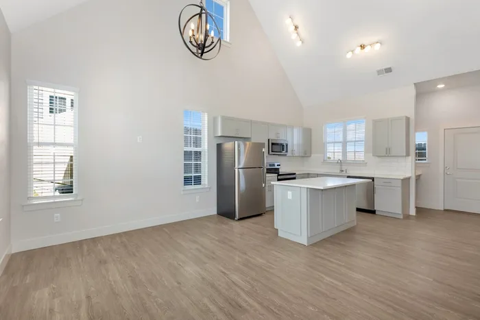 two story home kitchen and living room