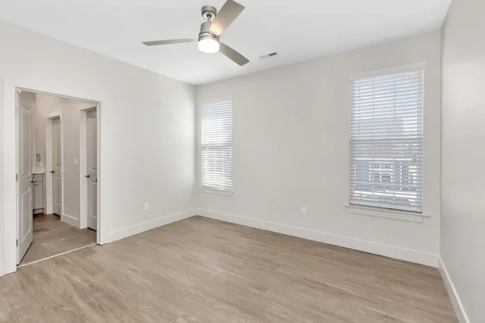 Bedroom with ceilings fan and wood style flooring