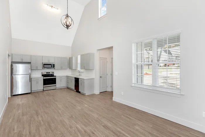 kitchen and living area with vaulted ceilings