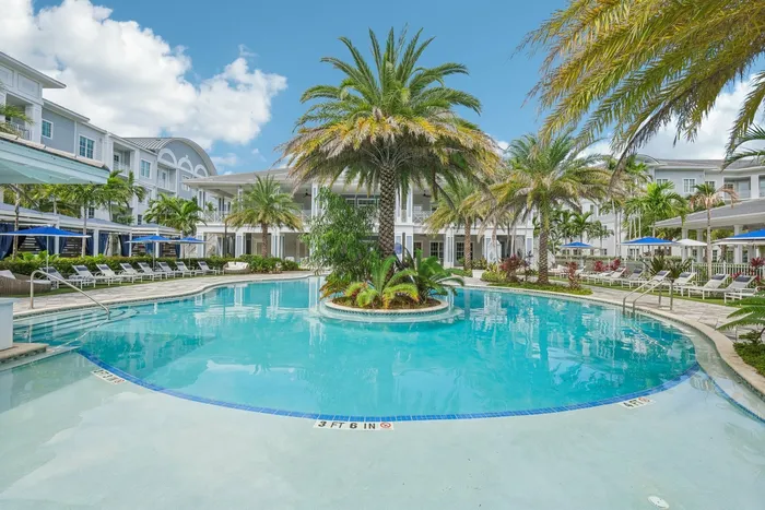 Outdoor community pool with greenery