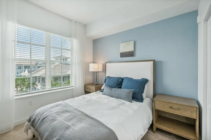 Furnished bedroom with bed and window