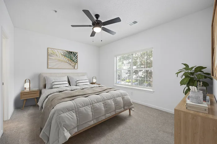 Virtually staged bedroom with bed and dresser