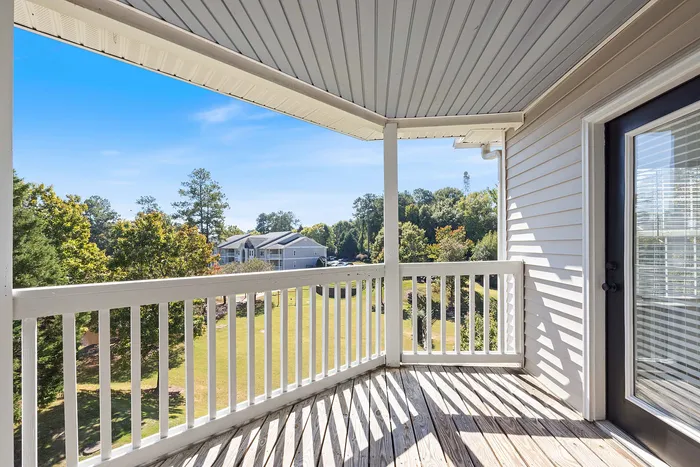 Covered back deck with view of community