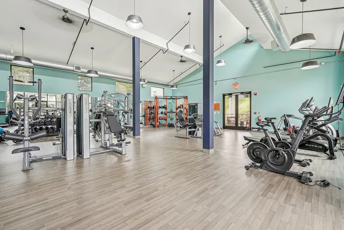 indoor fitness center with cardio and weight equipment
