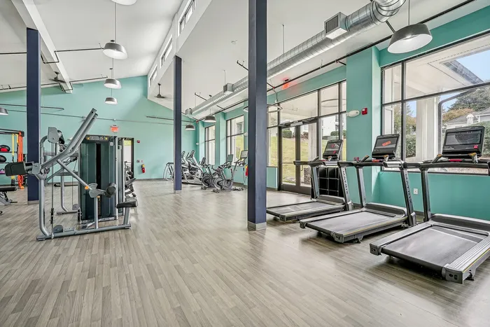 indoor fitness center with cardio and weight equipment
