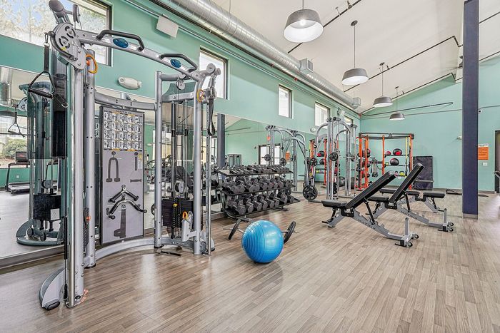 indoor fitness center with cardio and weight equipment