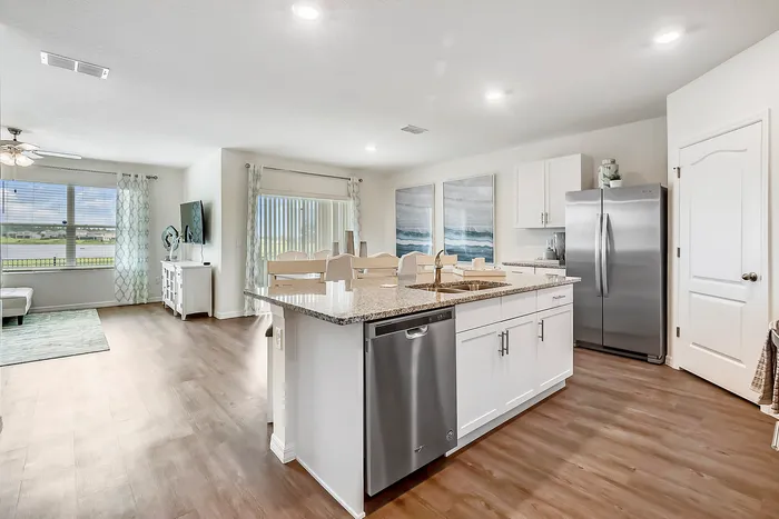 3-Bedroom Single Family Homes for Rent in Fairview, NC - Fairview Meadows - Chef-Inspired Kitchens with Wood-Inspired Plank Flooring, Kitchen Island, Stainless Steel Appliances, and Granite Countertops.