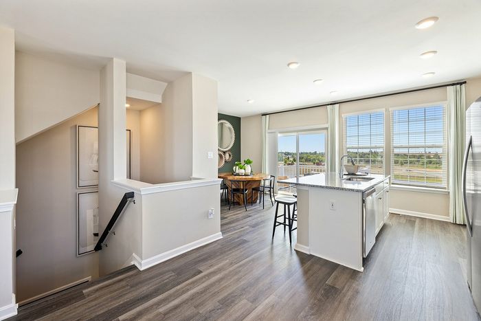 View of the kitchen and dining area and stairs heading down